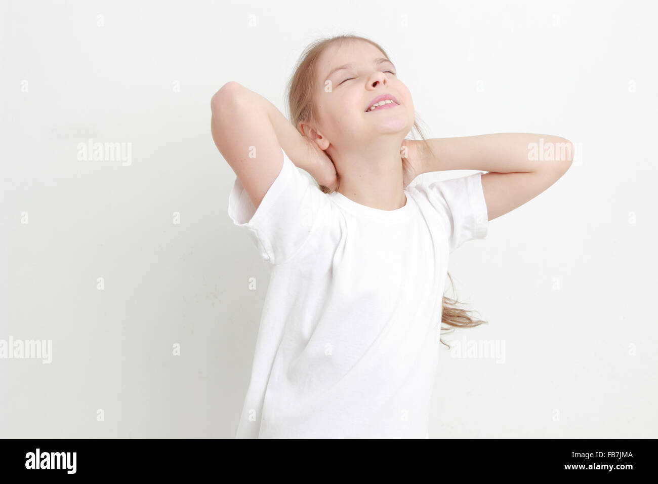 Funny girl poses faces for the camera Stock Photo Alamy