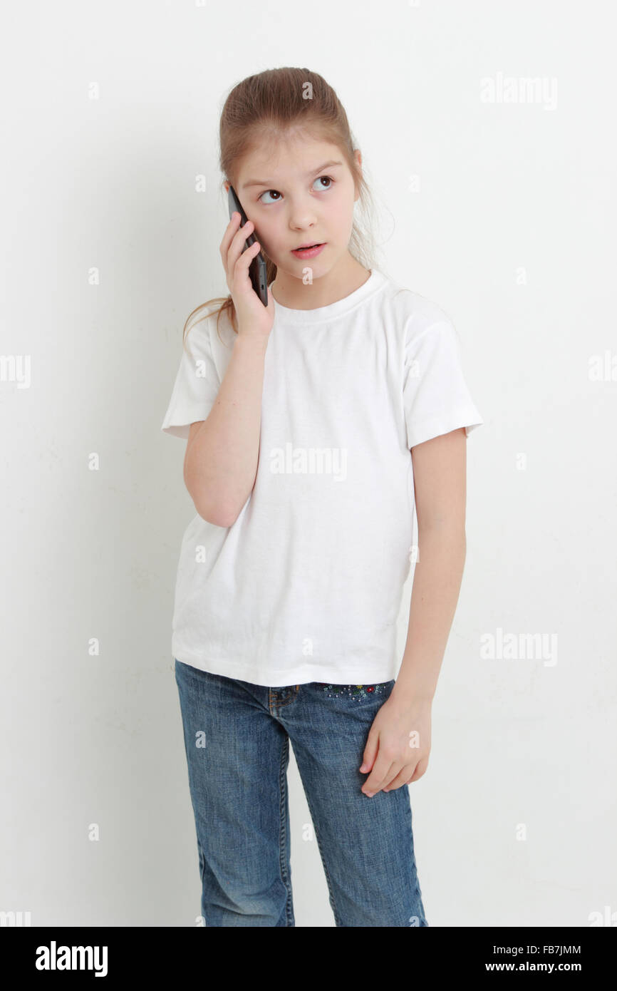 Lovely little girl and mobile phone Stock Photo Alamy