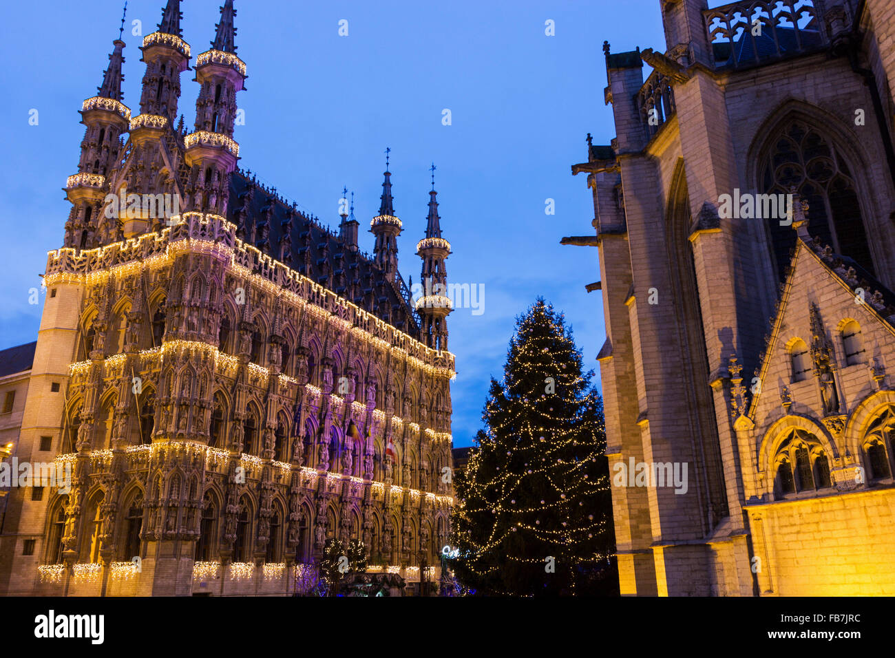 Magnificent City Hall of Leuven and St. Peter's Church in Belgium during Christmas Stock Photo