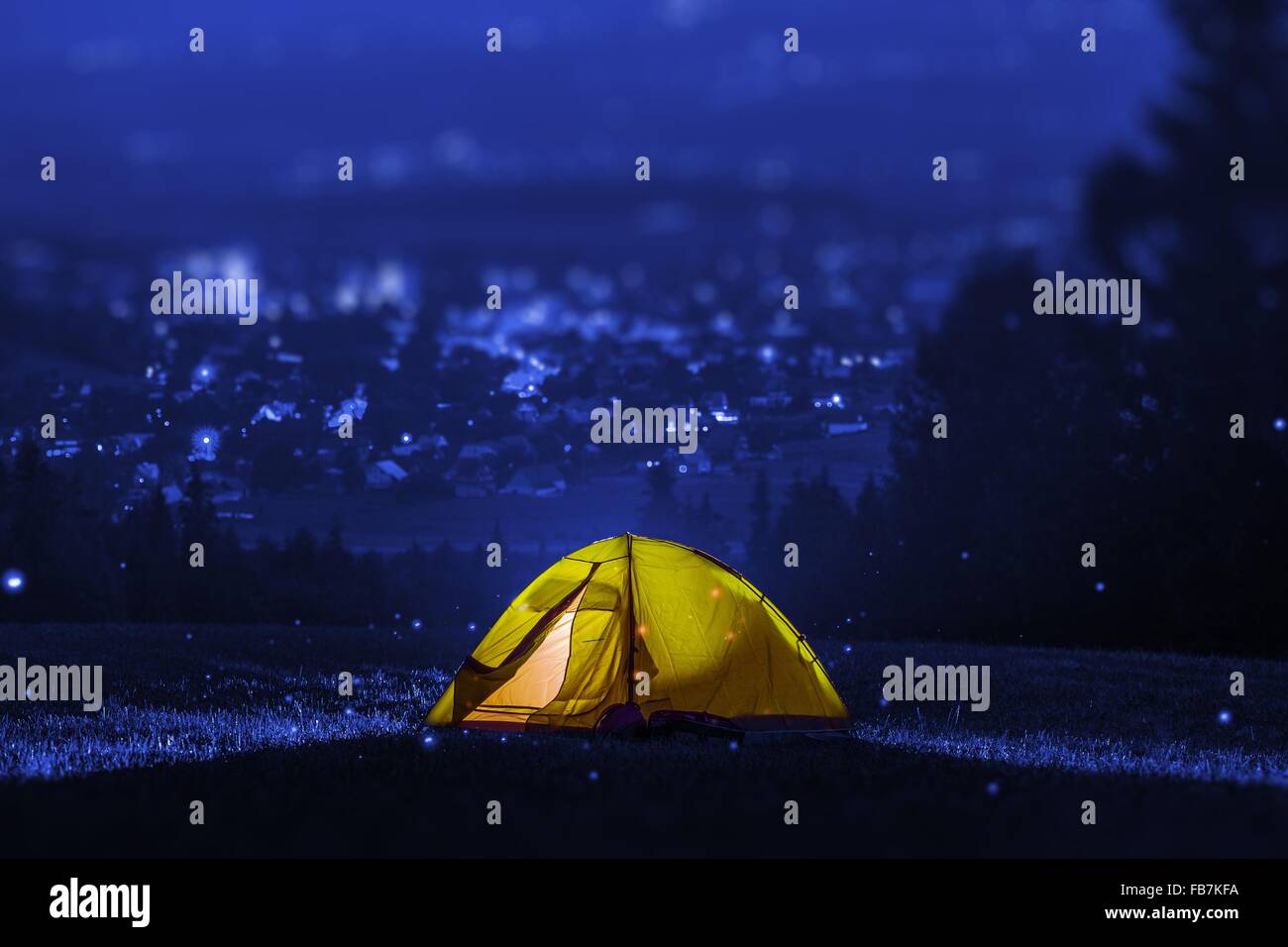 Campsite Near City. Small Tent Camping with City View. Outdoor Recreation Theme. Stock Photo