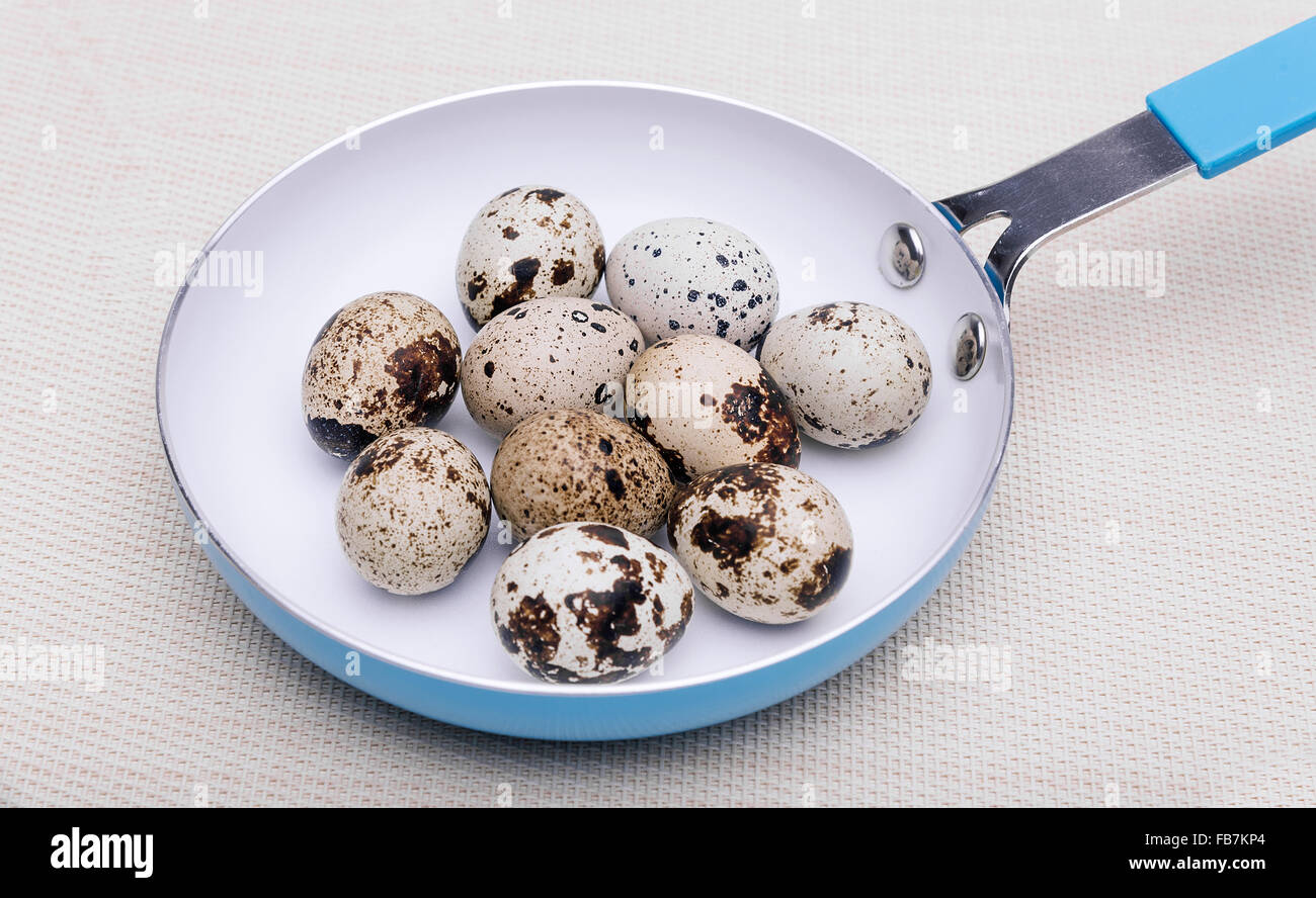 Quail eggs in a frying pan Stock Photo Alamy
