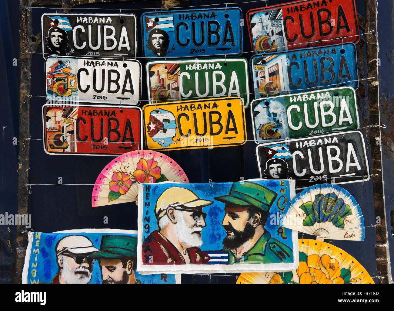 Souvenir license plates and Fidel Castro/Ernest Hemingway paintings, Havana, Cuba Stock Photo