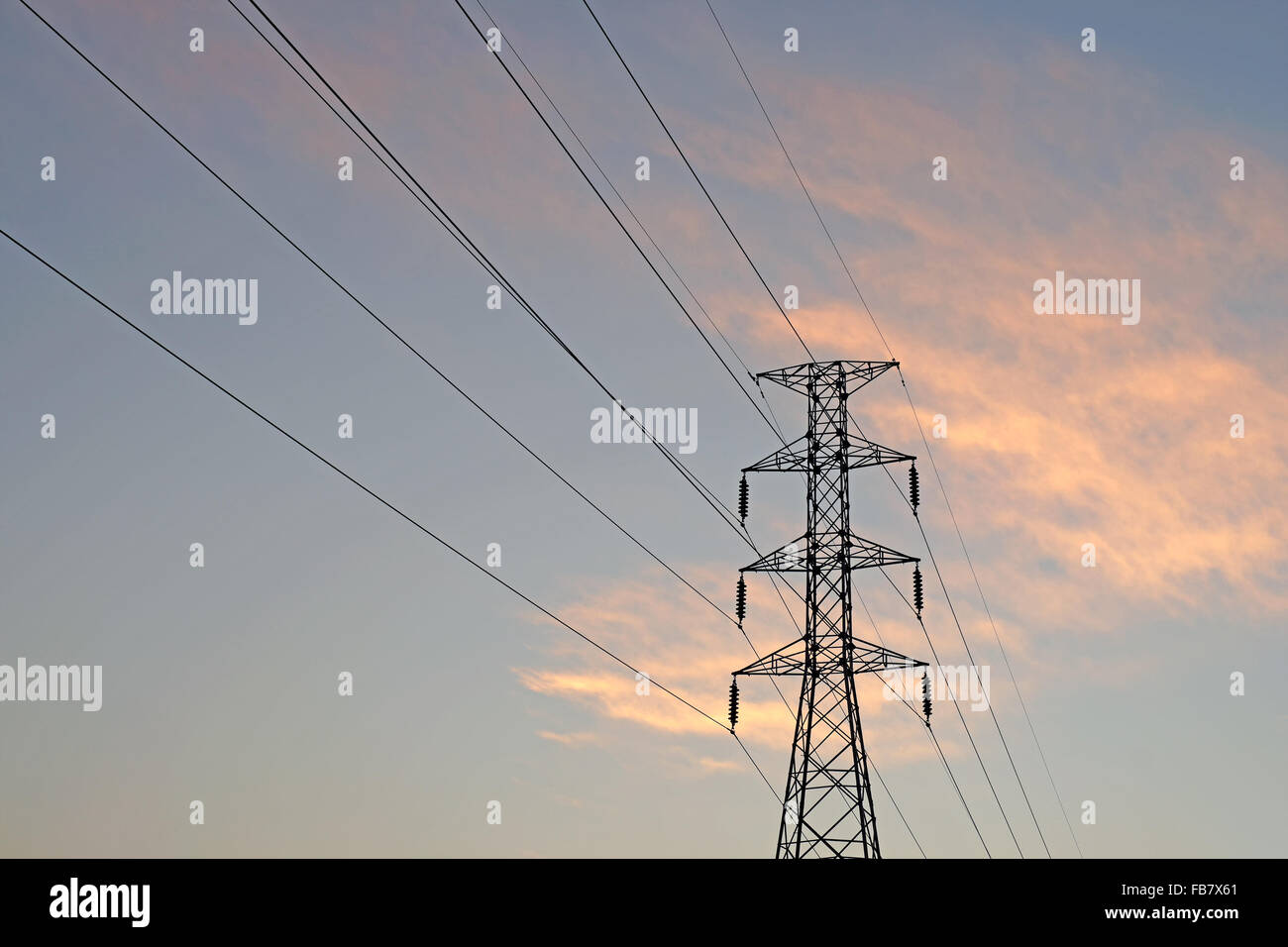 silhouette of high voltage electric tower with beautiful twilight ...