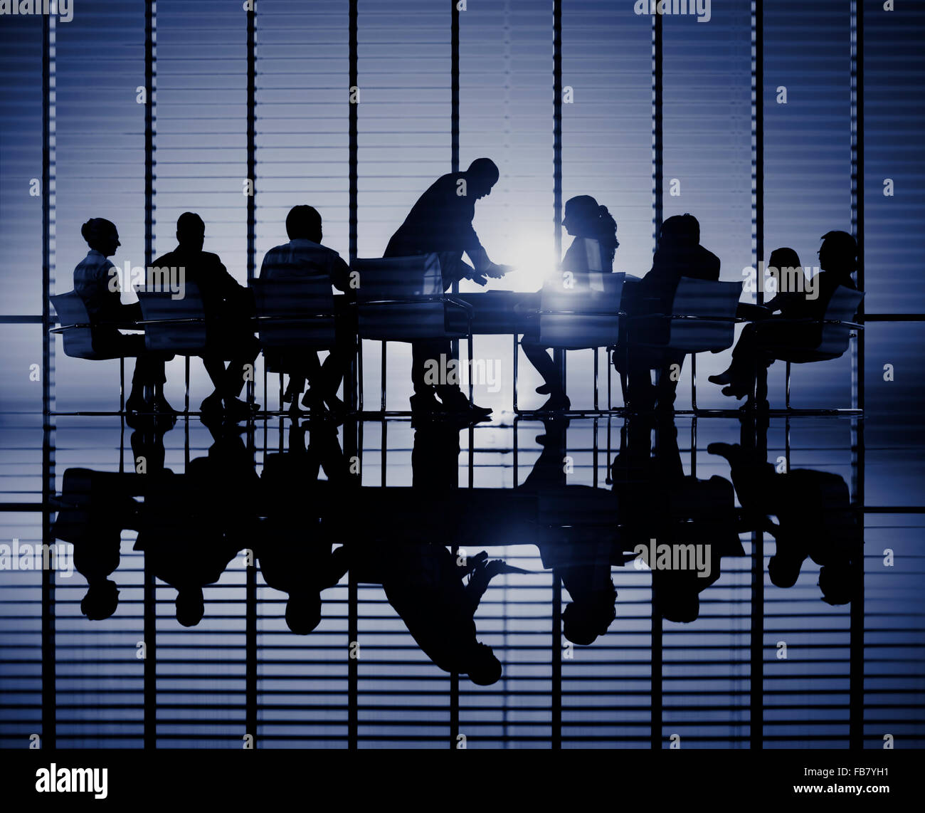 Silhouettes of business people in a conference room Concept Stock Photo