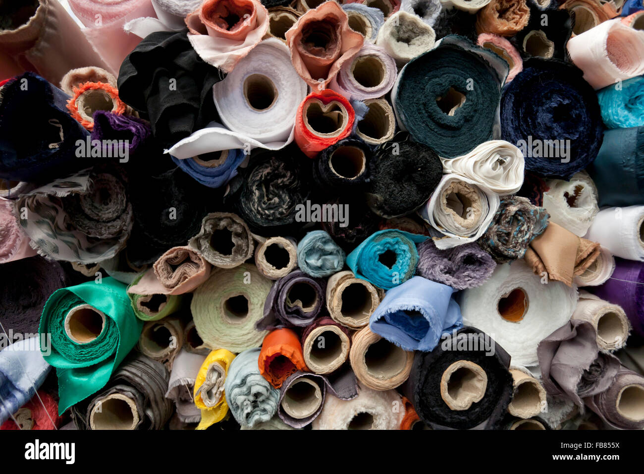 Rolls of fabric and textiles in a shop Stock Photo