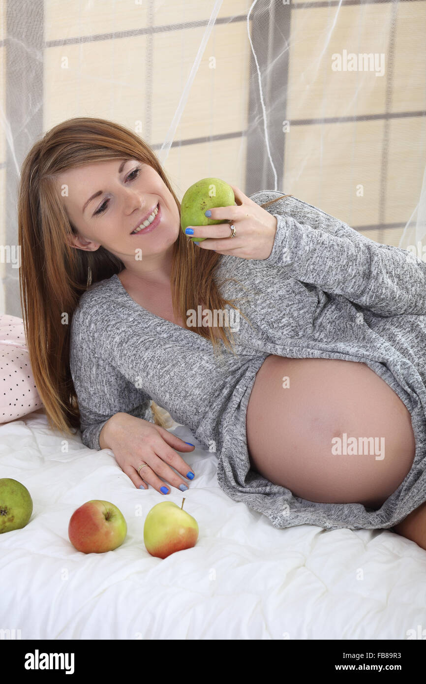 Beautiful Pregnant Woman Eats Fruit Stock Photo 92996375 Alamy