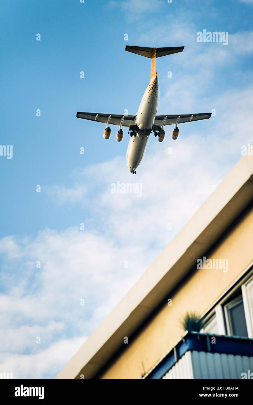 Sweden, Uppland, Kungsholmen, Low-angle view of commercial airplane in sky Stock Photo