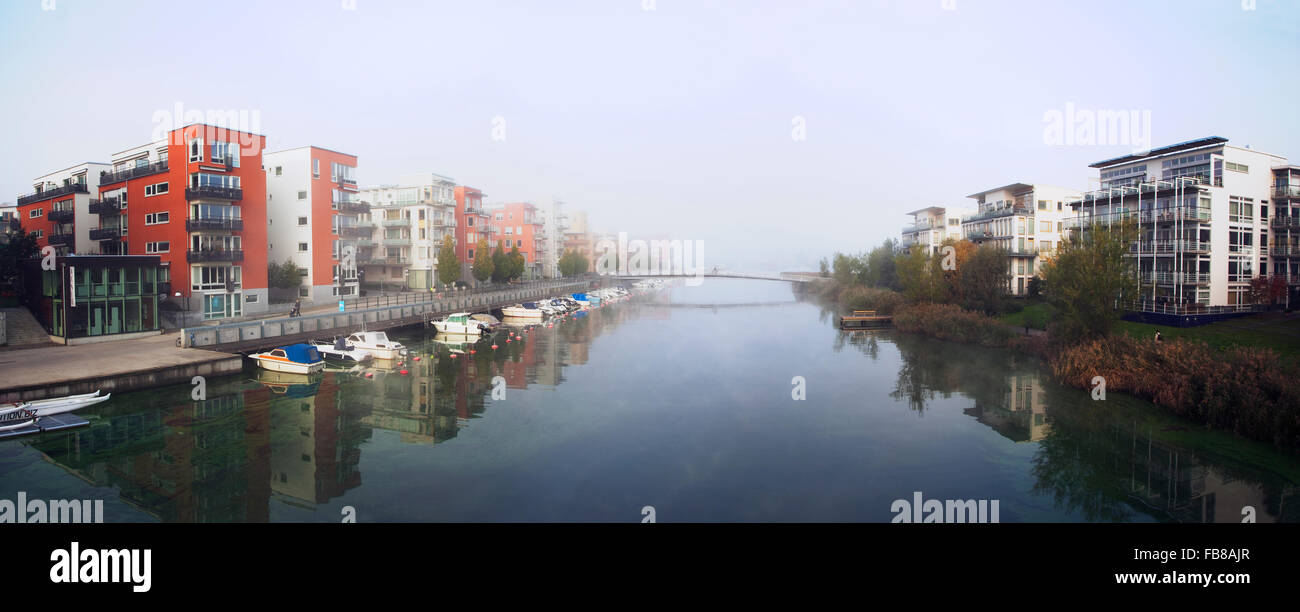 Sweden, Stockholm, Hammarby Sjostad, Panoramic view of buildings on riverbanks Stock Photo