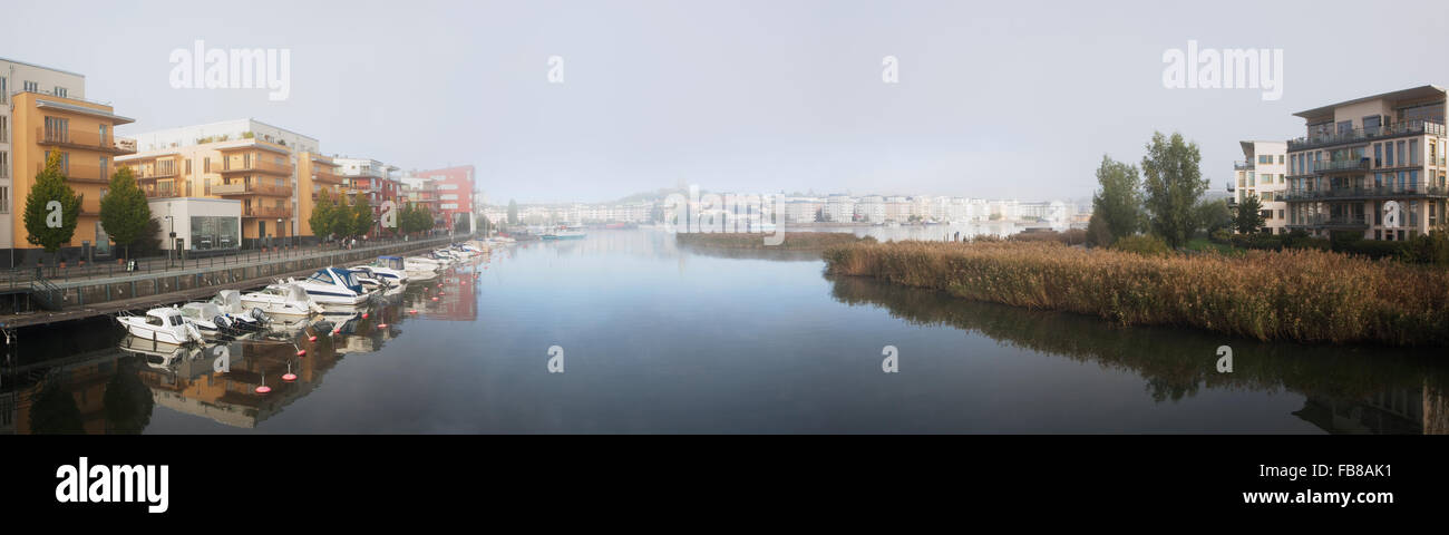 Sweden, Stockholm, Hammarby Sjostad, Panoramic view of buildings on riverbanks Stock Photo
