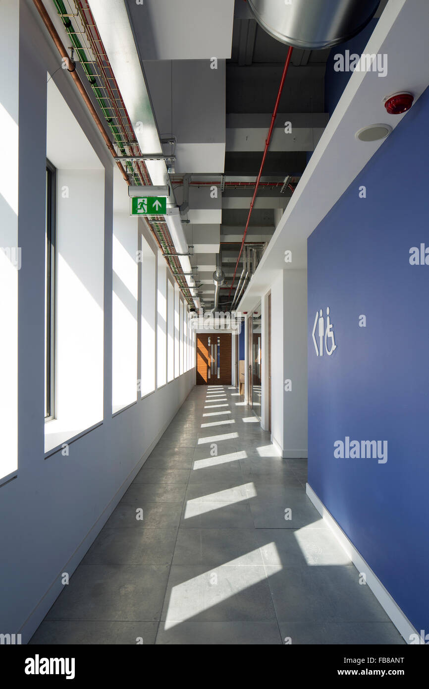 View of 3rd floor  'Solar Corridor'. Cockcroft Building, University of Brighton (RETROFIT), Brighton, United Kingdom. Architect: Stock Photo