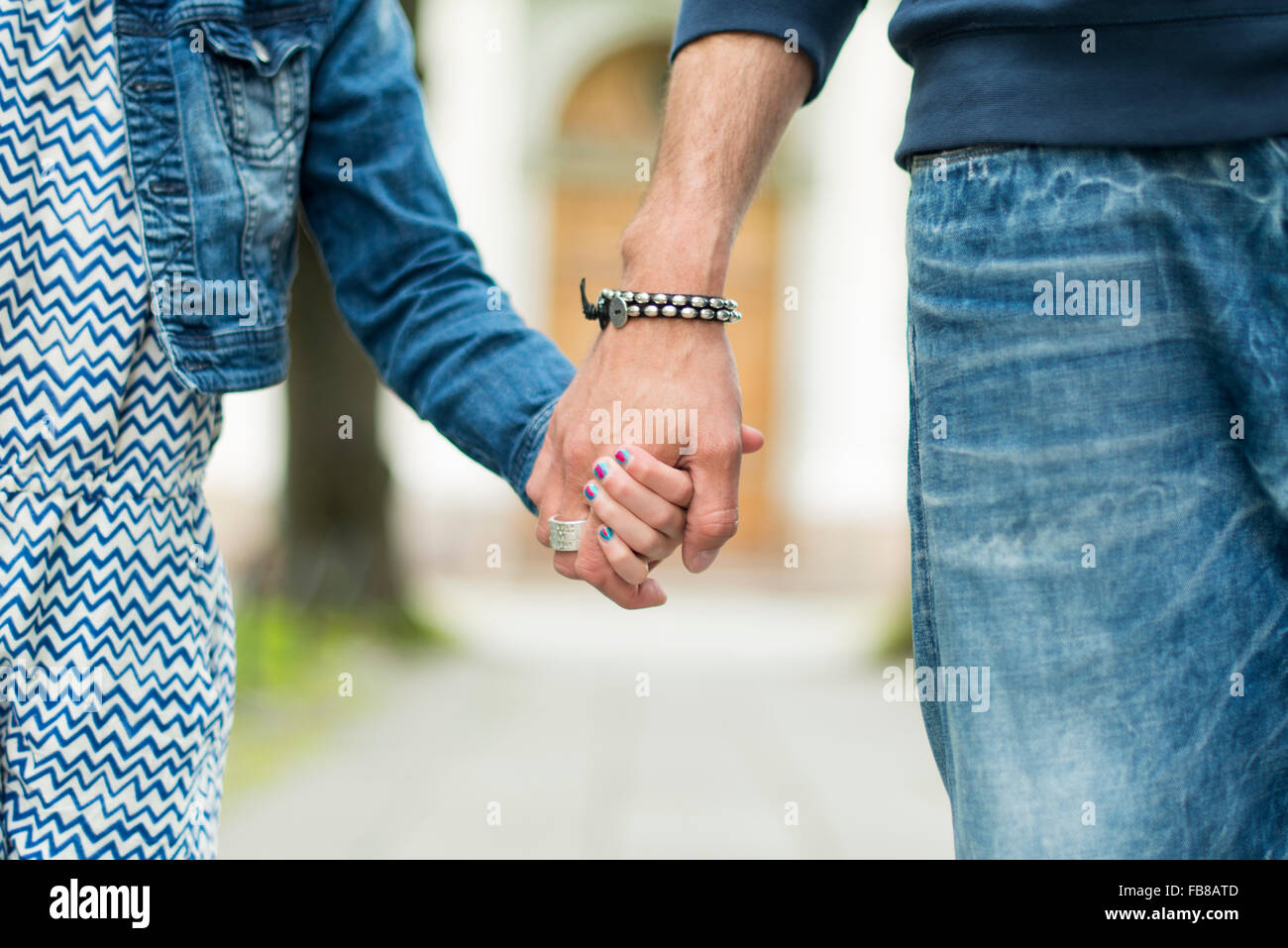 Sweden, Father and daughter (8-9) holding hands Stock Photo