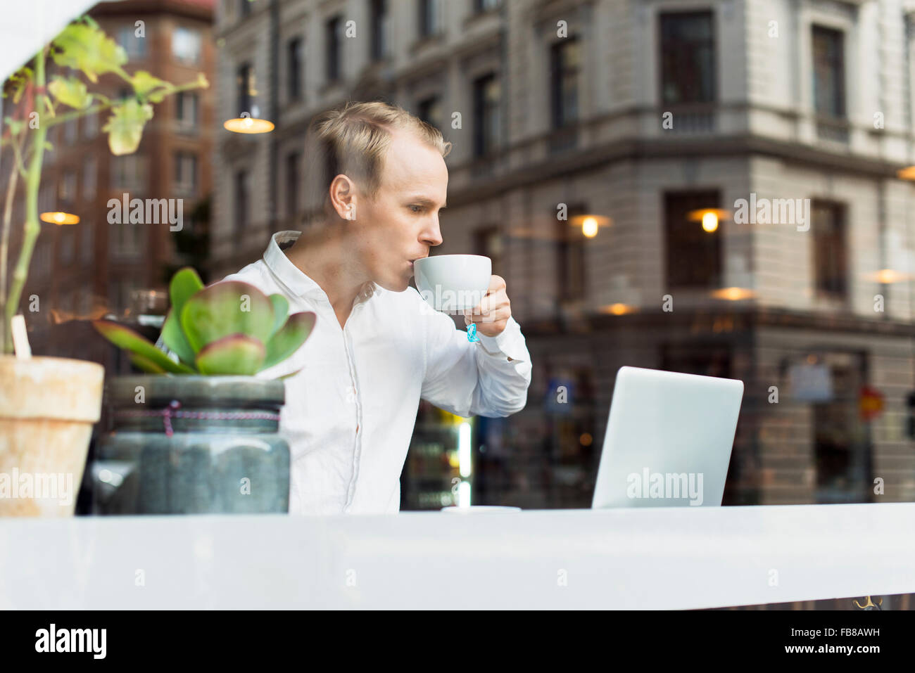 Sweden, Uppland, Stockholm, Man drinking tea Stock Photo