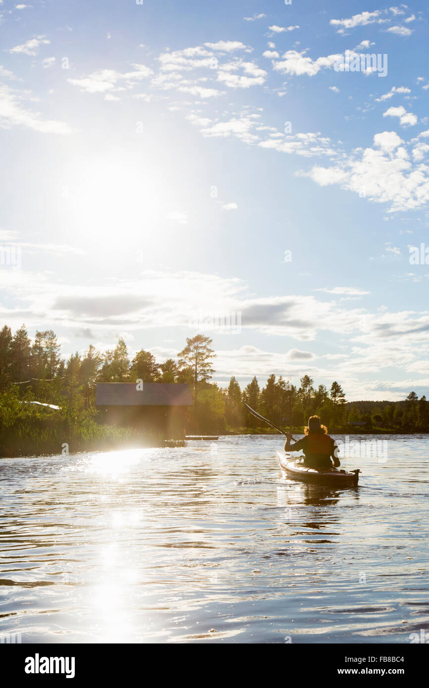 Sweden, Medelpad, Sundsvall, Juniskar, Mid adult man in canoe Stock Photo