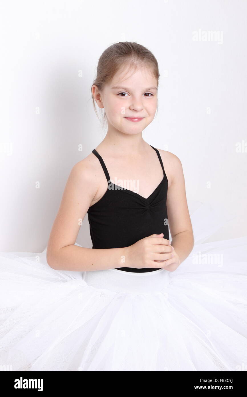 little ballerina in studio posing on camera Stock Photo