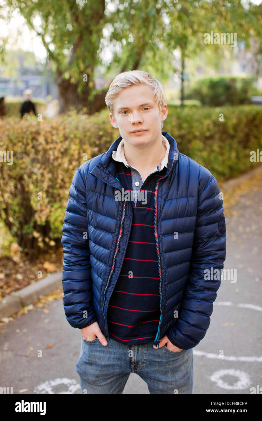 Sweden, Sodermanland, Strangnas, Portrait of teenage boy (16-17) in schoolyard Stock Photo