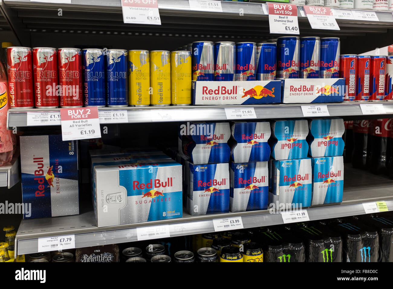 Multi packs of energy drinks on shelves in a supermarket, UK Stock Photo