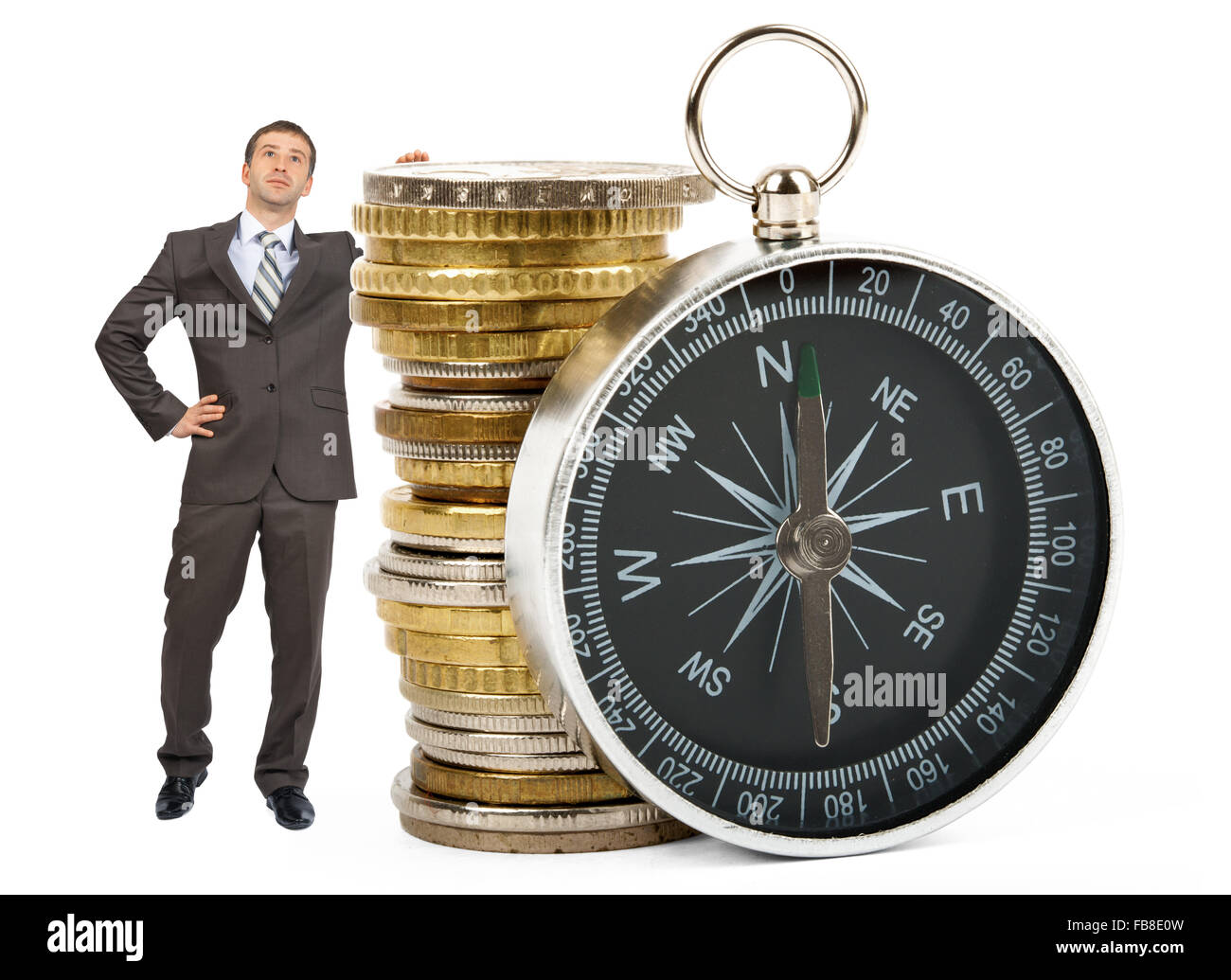 Businessman with big stack of coins Stock Photo - Alamy