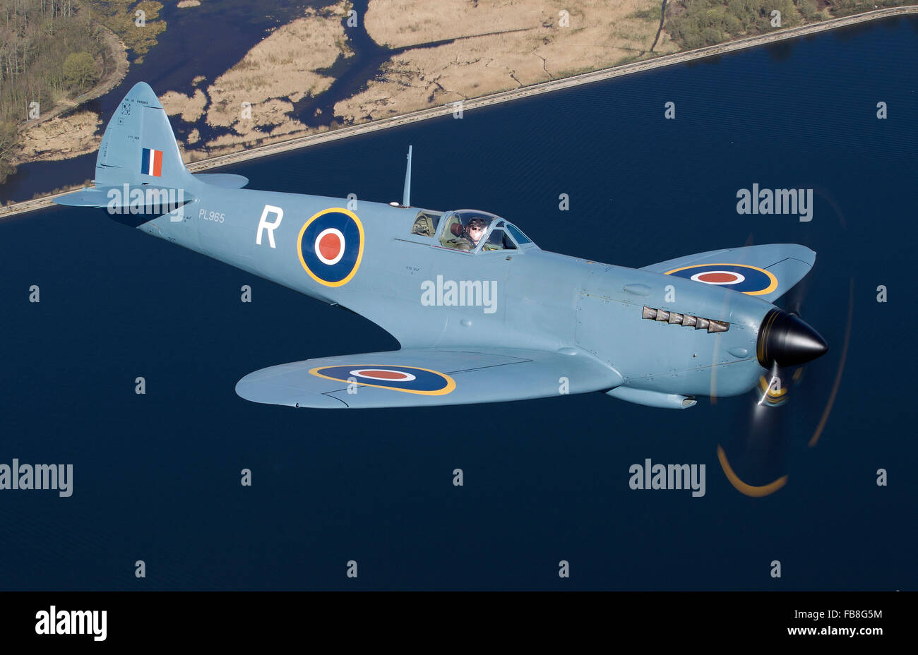 Supermarine Spitfire PR XI over land Stock Photo