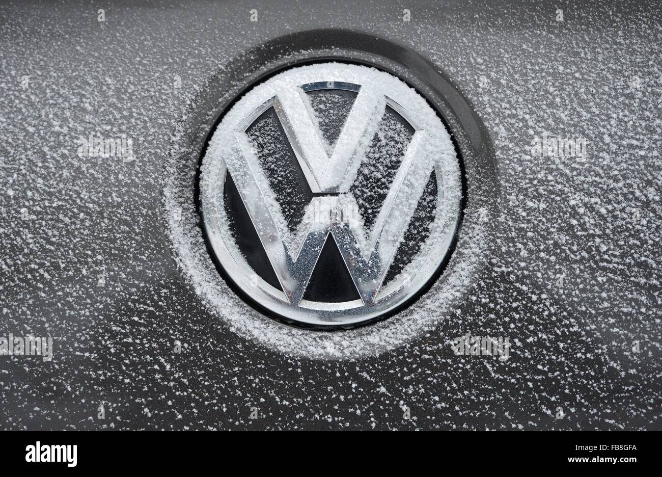 VW logo with snow, Germany, city of Osterode, 6. January 2016. Photo: Frank May Stock Photo