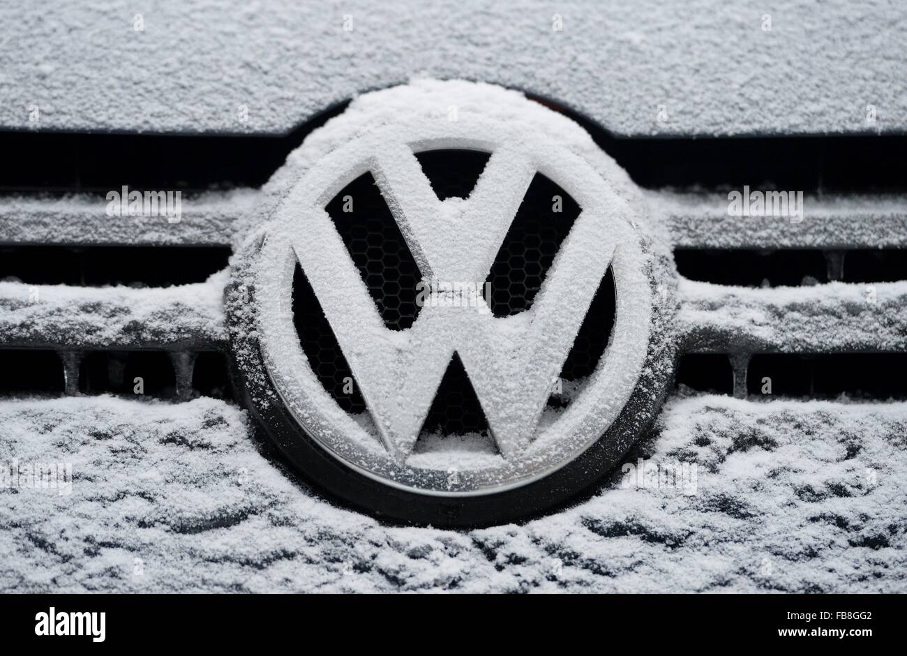 VW logo with snow, Germany, city of Osterode, 6. January 2016. Photo: Frank May Stock Photo