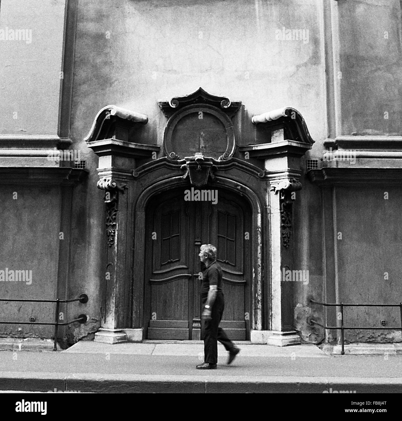 Glance on Bupapest at the time of the Nineties. -  1990  -  Hungary / Budapest  -  Glance on Bupapest at the time of the Nineties. -  Passer-by in front of a side door of St Anne's church.   -  Philippe Gras / Le Pictorium Stock Photo