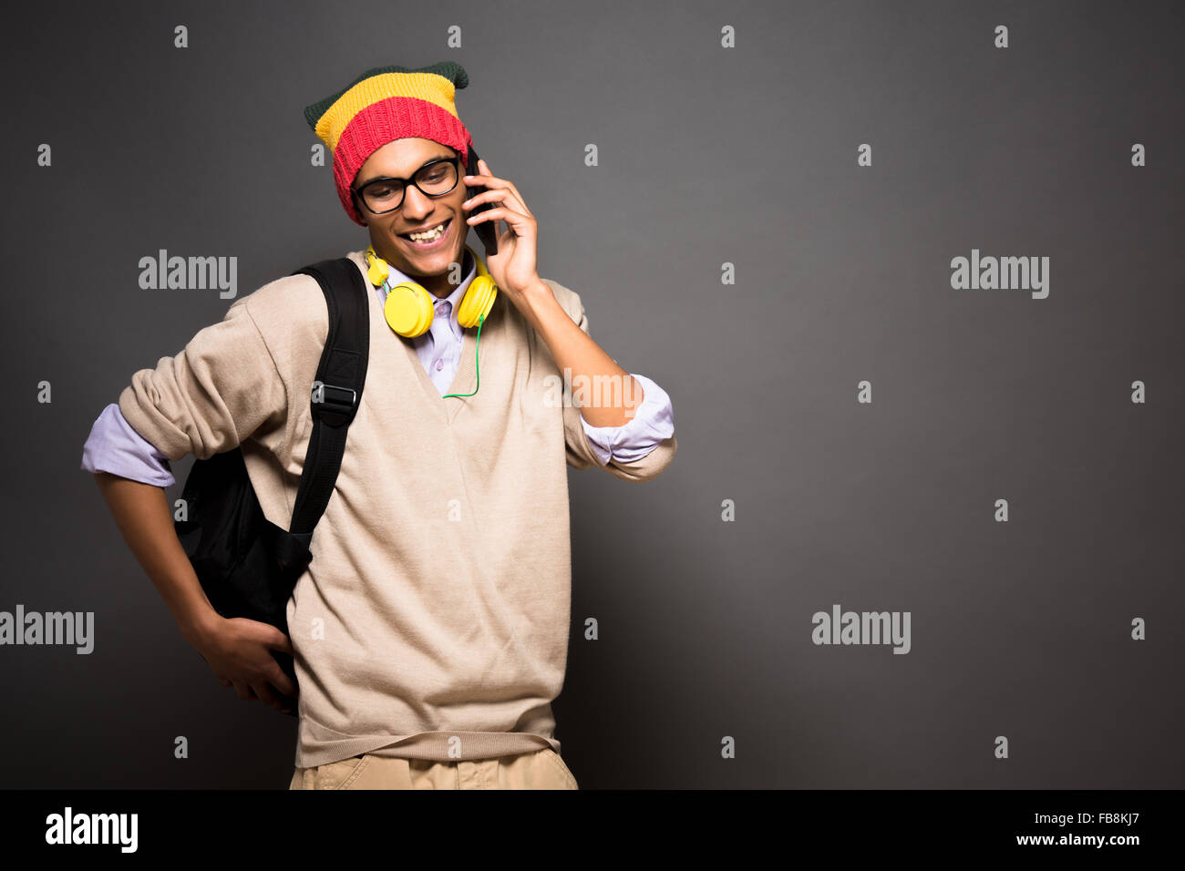 Hipster brazilian student talking over mobile phone Stock Photo