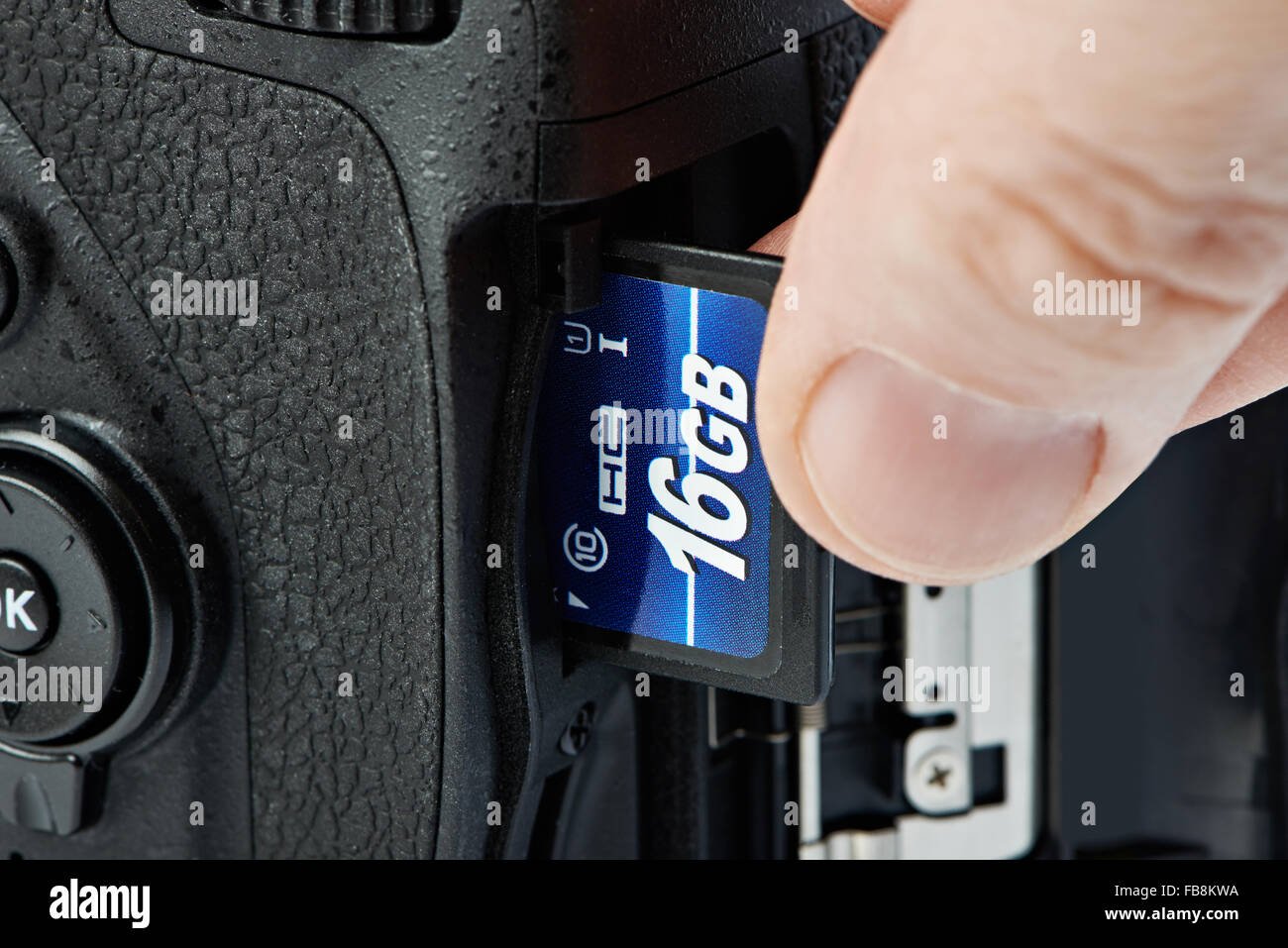 Flash card SD and DSLR camera close-up Stock Photo
