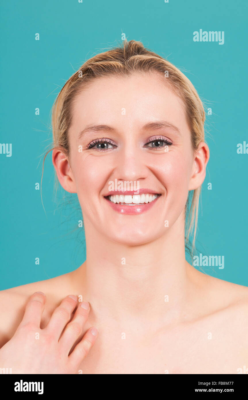 Happy young woman smiling Stock Photo - Alamy