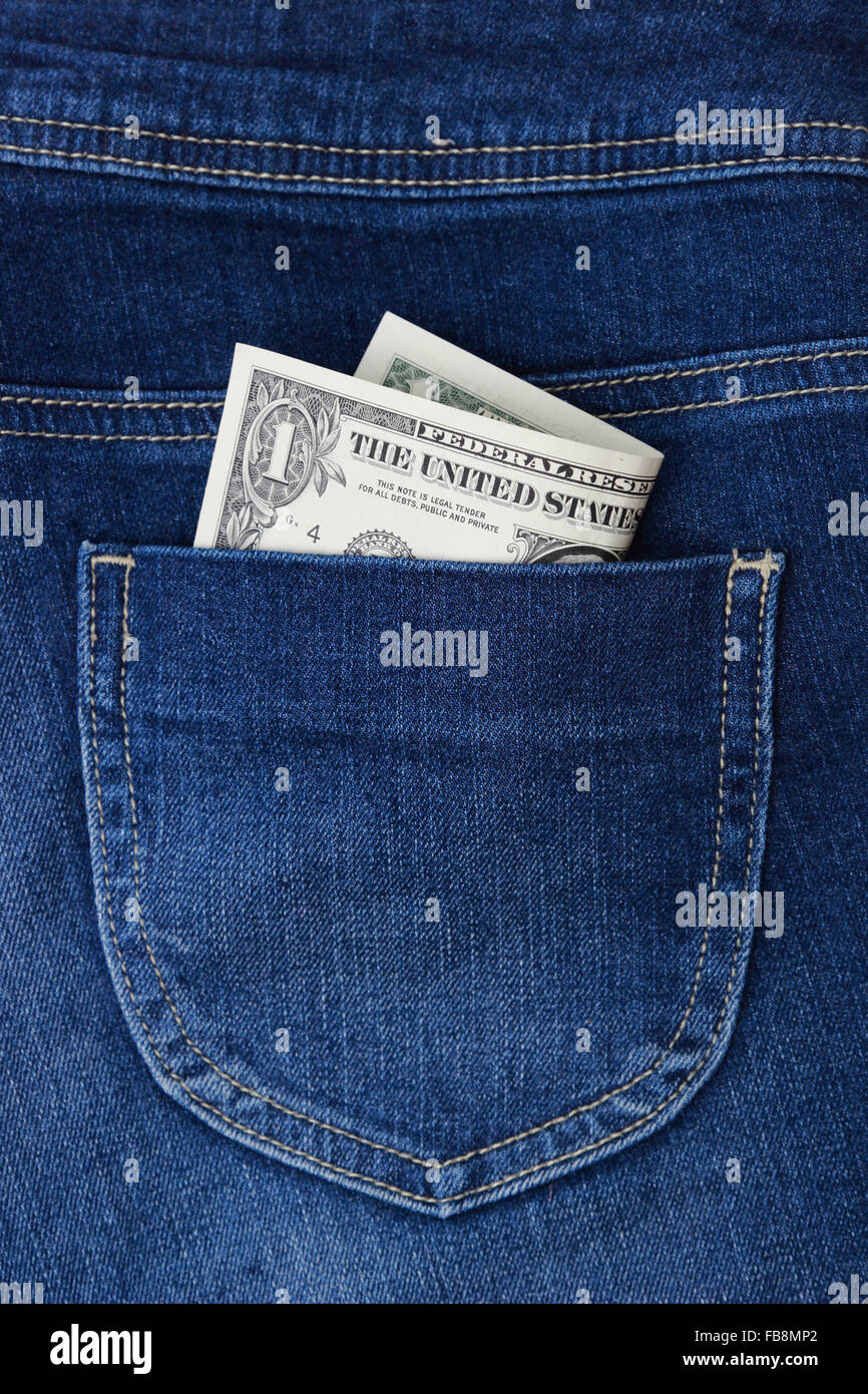 One dollar in denim pocket top view image Stock Photo