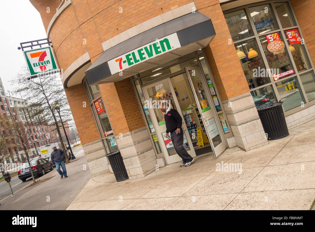 ARLINGTON, VIRGINIA, USA - Man leaving 7-eleven convenience store in Clarendon neighborhood. Stock Photo