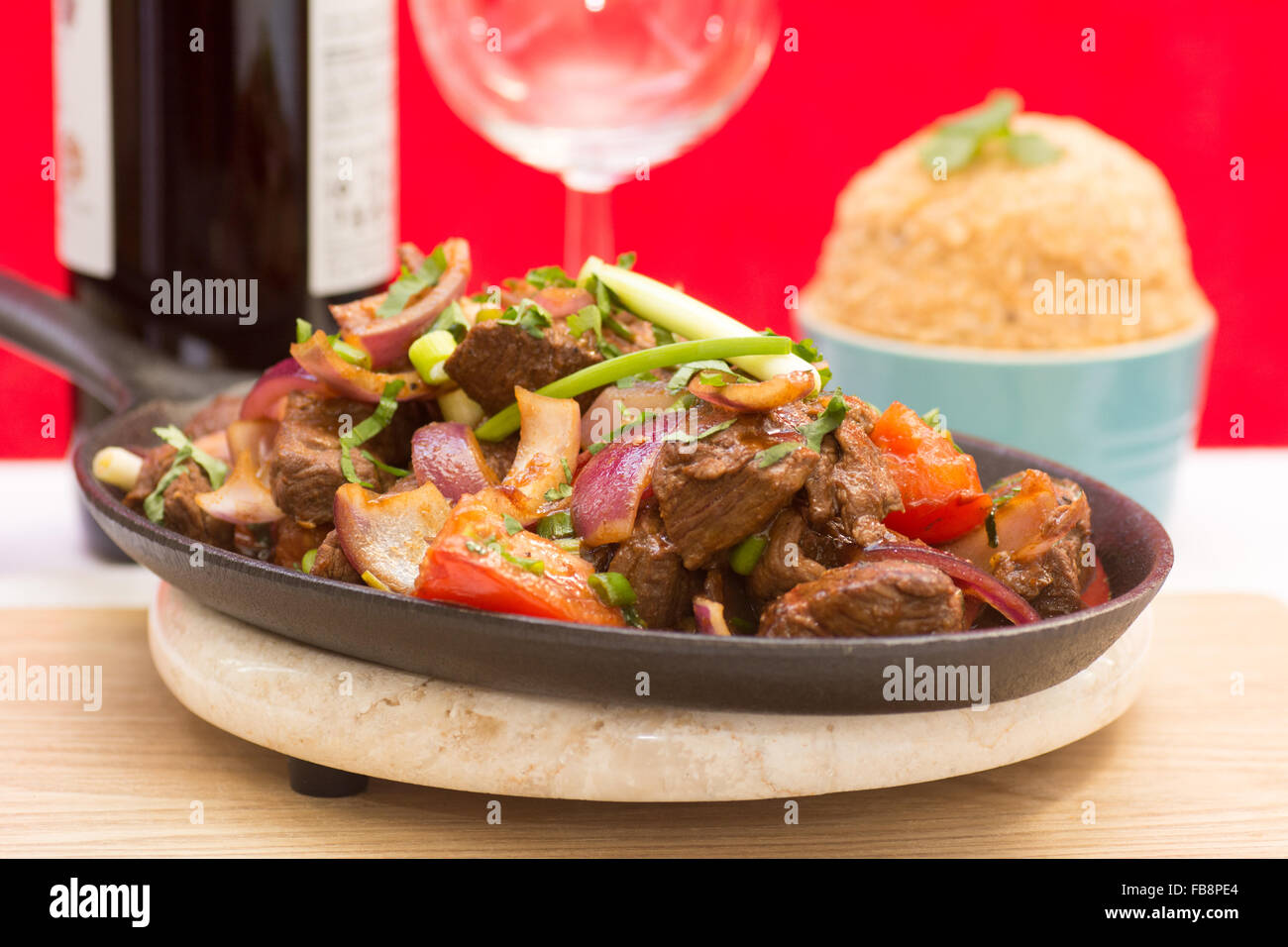 Lomo Saltado - a very popular dish in Peru of stir-fried beef with a side dish of Tacu Taco rice Stock Photo