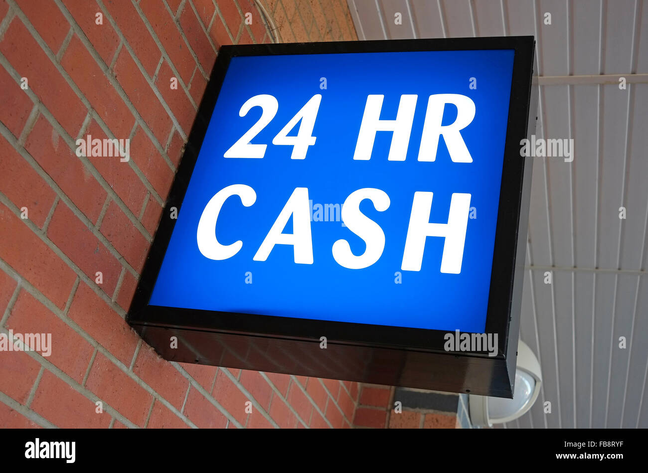 24 hr cash sign above atm machine Stock Photo