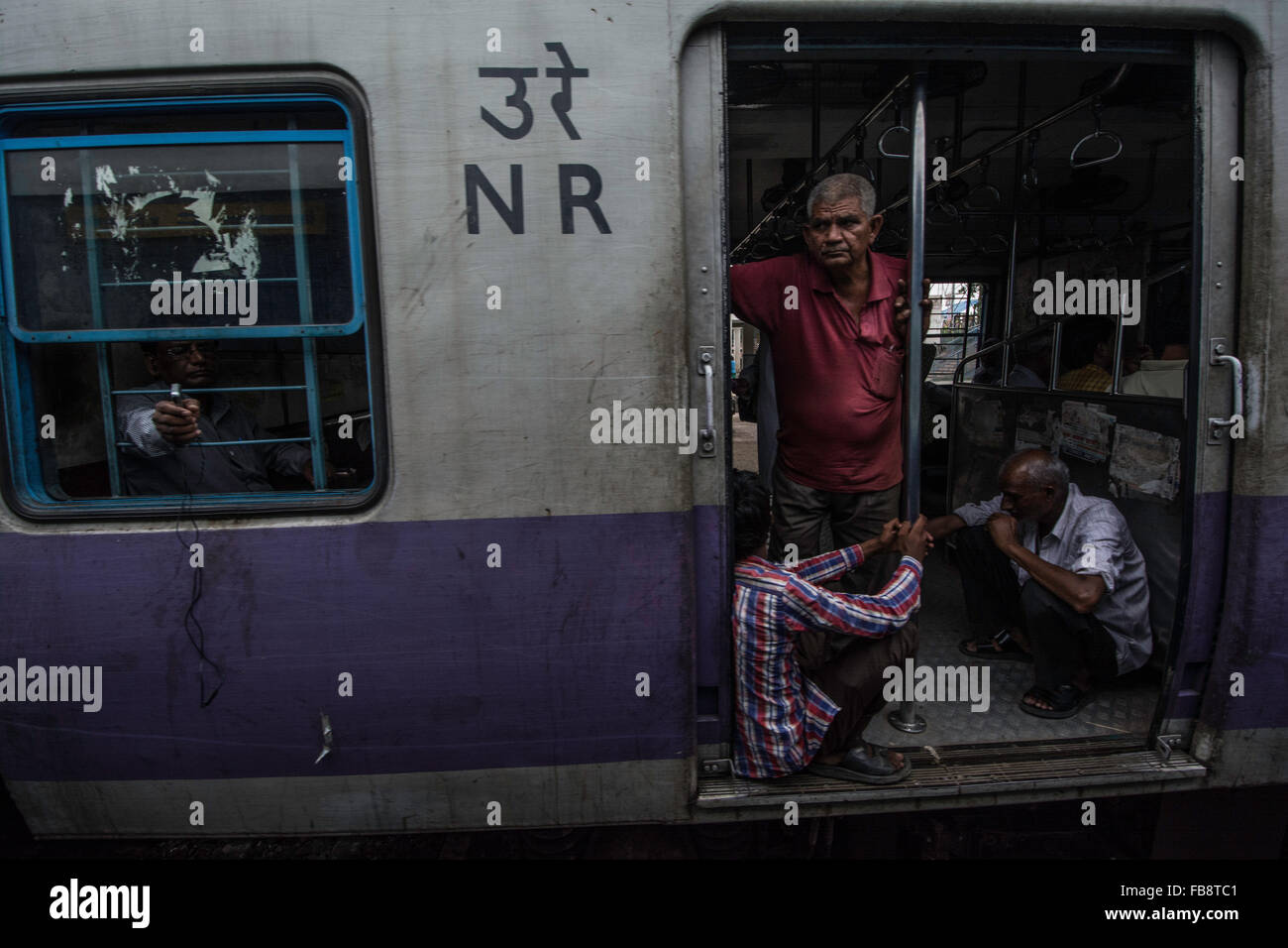 Unidentified Passengers Standing on the Doors of Running Local Train during  Rush Hours Editorial Photography - Image of station, india: 168031082