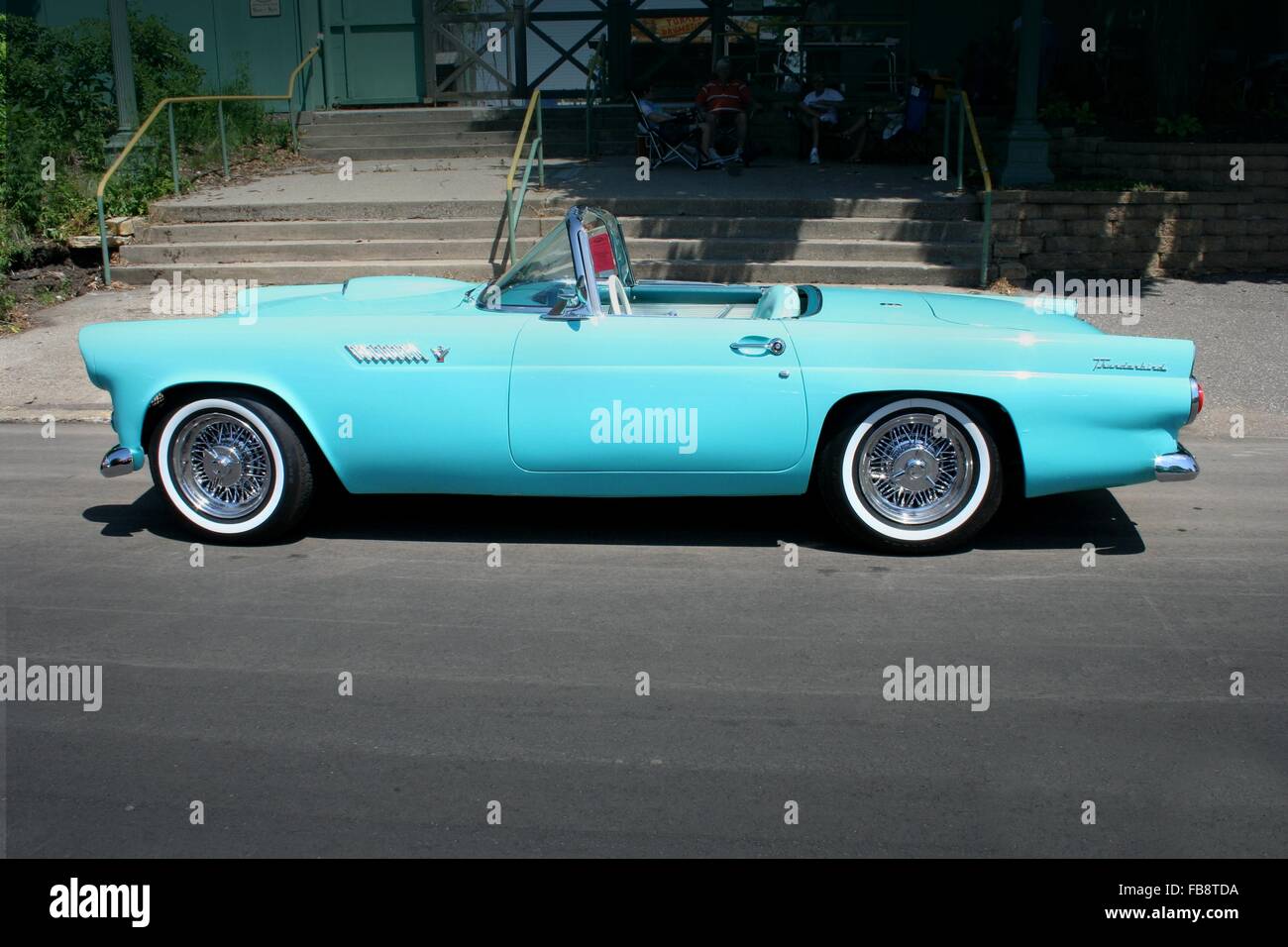 1955 classic car an aqua 'turquoise' blue Ford Thunderbird convertible with the top down in summer Stock Photo