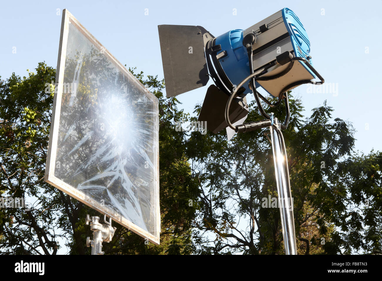 Professional movie lighting equipment with filter and tripods in outdoors Stock Photo