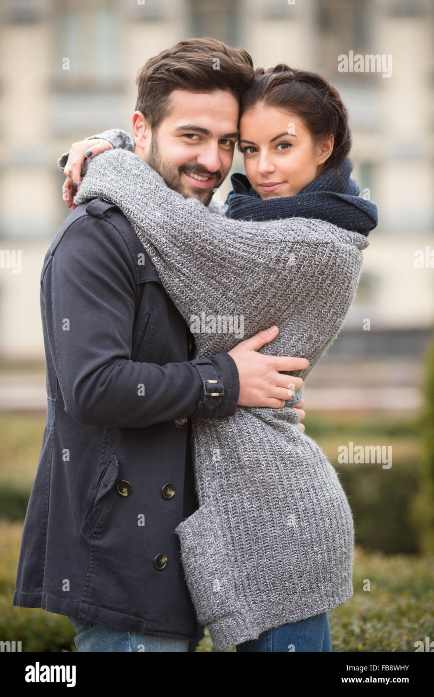 Happy couple hugging in the autumn park Stock Photo - Alamy