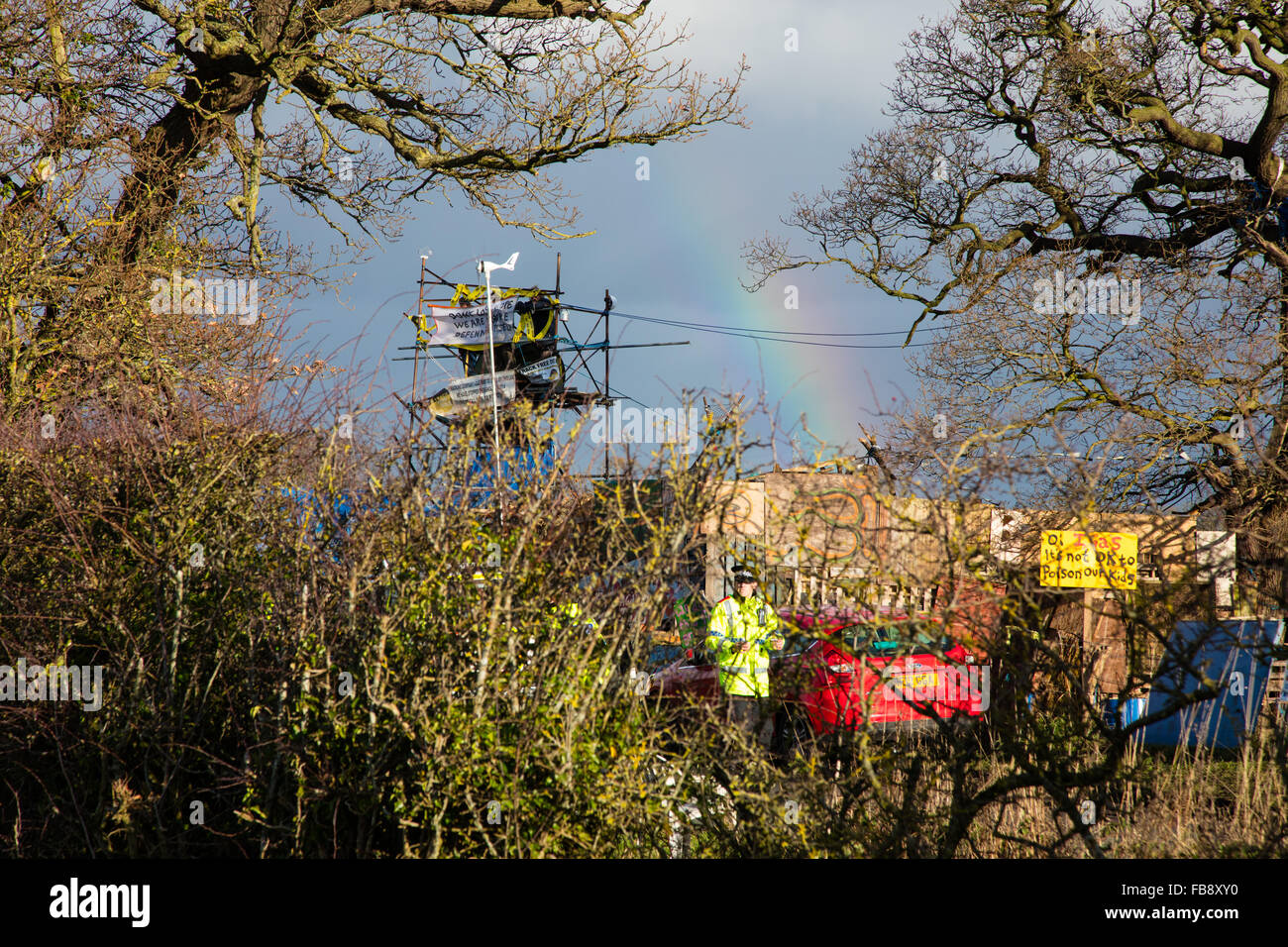 Upton, Cheshire. 12th Jan, 2016. Bailiffs removing locals, protestors and press from an adjoining field at Upton anti fracking camp as bailiffs and policemove in to evict the camp  Credit:  Jason Smalley / Alamy Live News Stock Photo