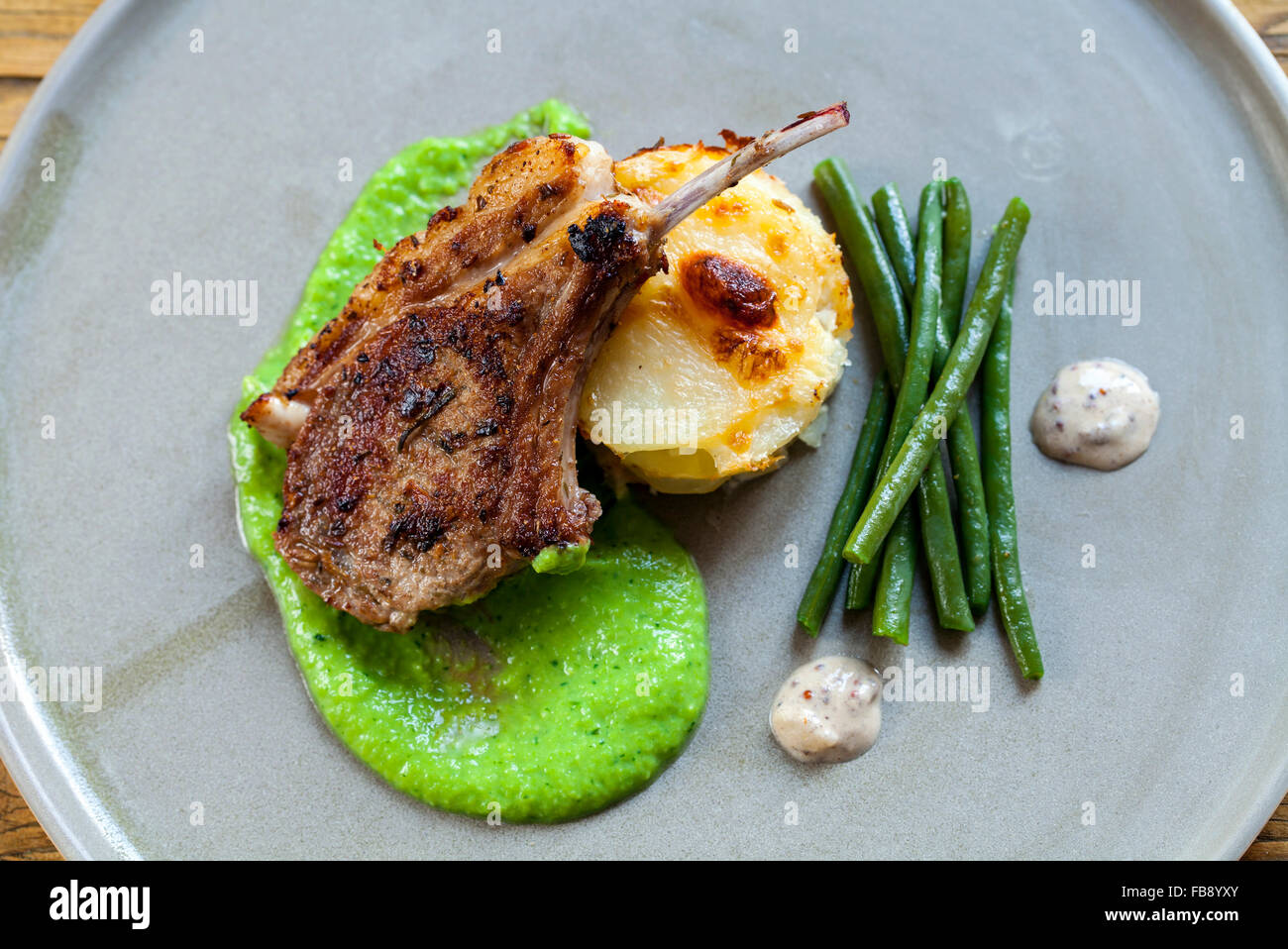 Lamb chop with peas puree and dauphinoise potatoes Stock Photo Alamy