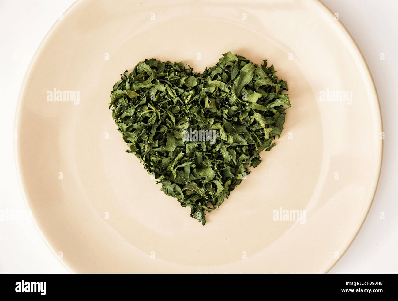 Heart shape of dried parsley on the plate. Valentine's day. Symbol of lovers Stock Photo Alamy