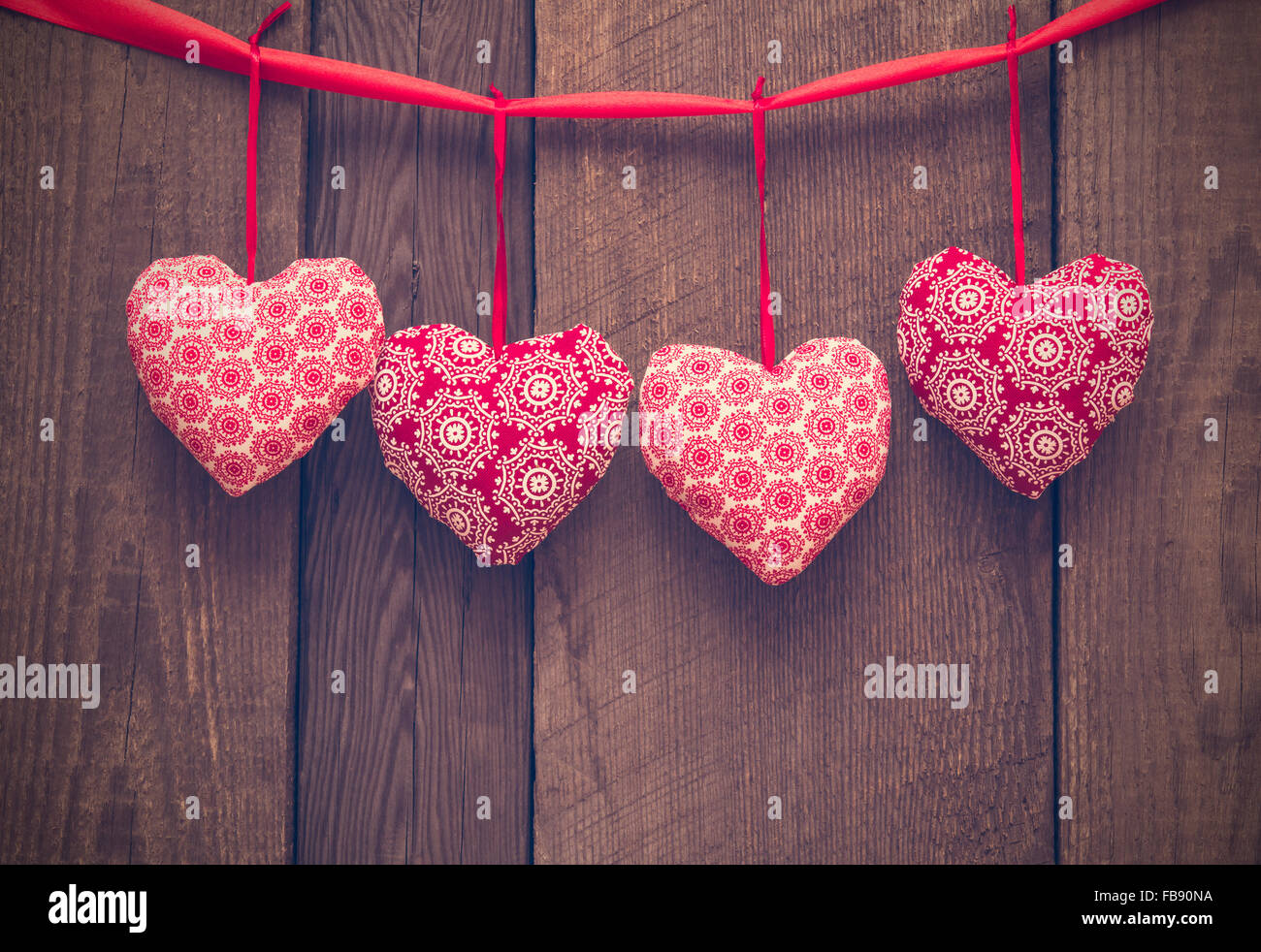Pink Fabric Heart Shaped Wreath Frame On Wood Background Wallpaper