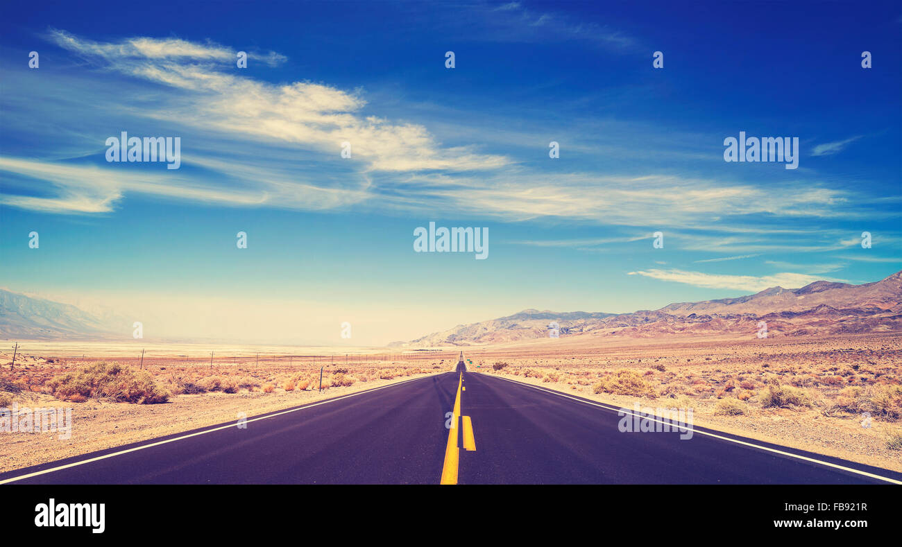 Vintage toned endless country highway, Death Valley, USA. Stock Photo