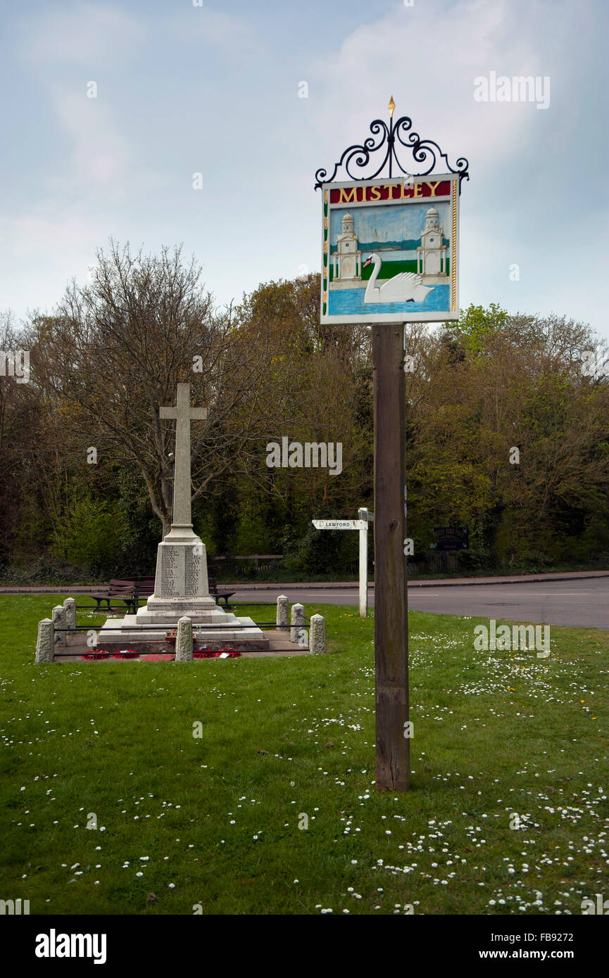 Mistley, Essex, Village sign with war memorial in background. Stock Photo