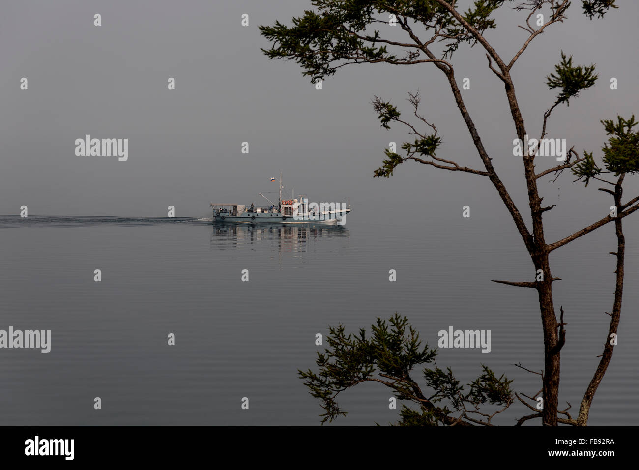 Boat navigating the waters of lake Baikal, Russia Stock Photo - Alamy
