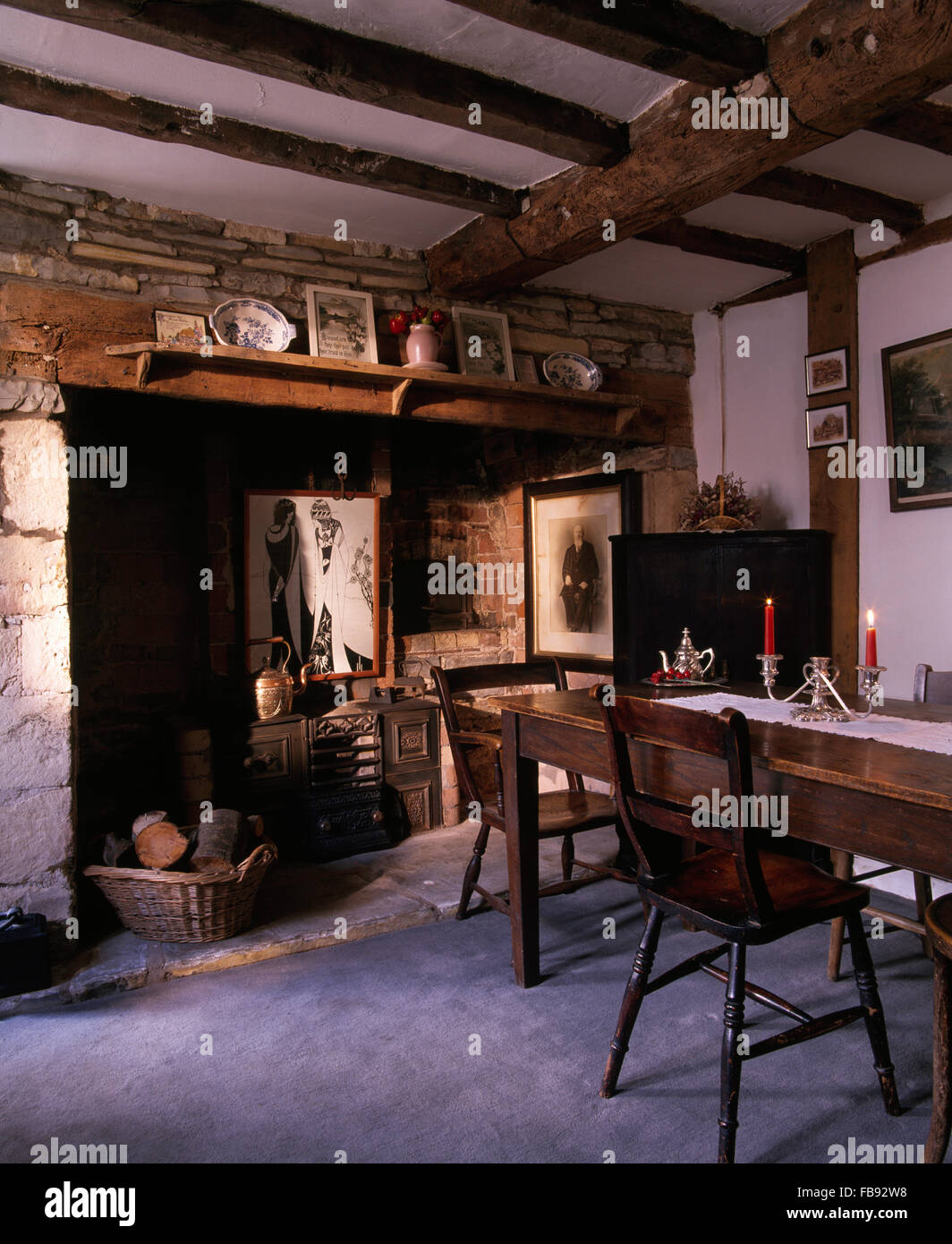 Inglenook Fireplace In Old Fashioned Victorian Style Dining Room