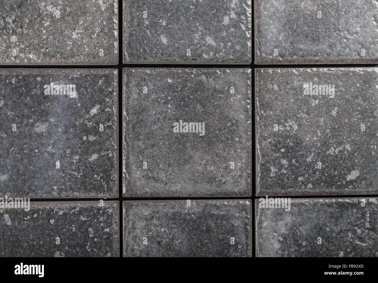 the background of gray ceramic tiles closeup Stock Photo