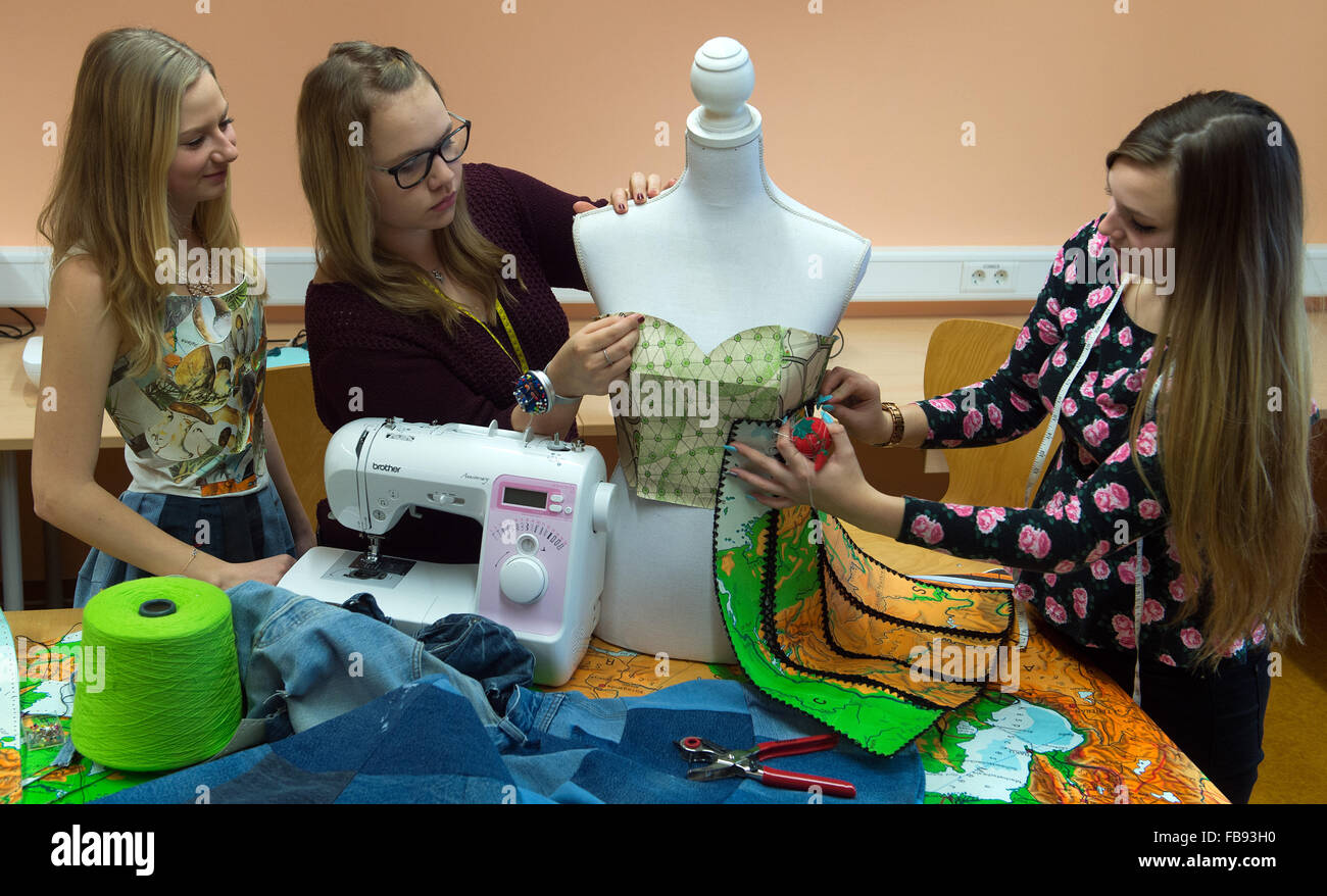 Bad Lauchstaedt, Germany. 11th Jan, 2016. Under the direction of the Schule fuer Mode und Design fashion school in Magdeburg, pupils Alina, Saskia and Lea (l-r) from the Goethe Schule in Bad Lauchstaedt make clothes for their new collection at Fashion Week, in Bad Lauchstaedt, Germany, 11 January 2016. The 40-minute show is due to take place in Berlin on 17 January. Photo: Hendrik Schmidt/ZB/dpa/Alamy Live News Stock Photo