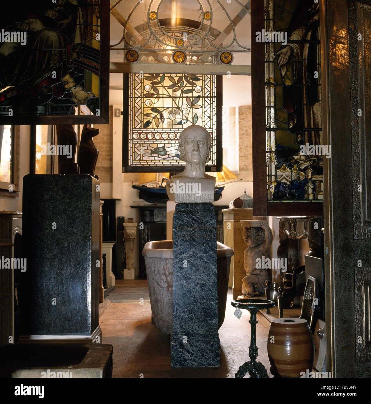 Antiques and collectables inside an architectural salvage store Stock