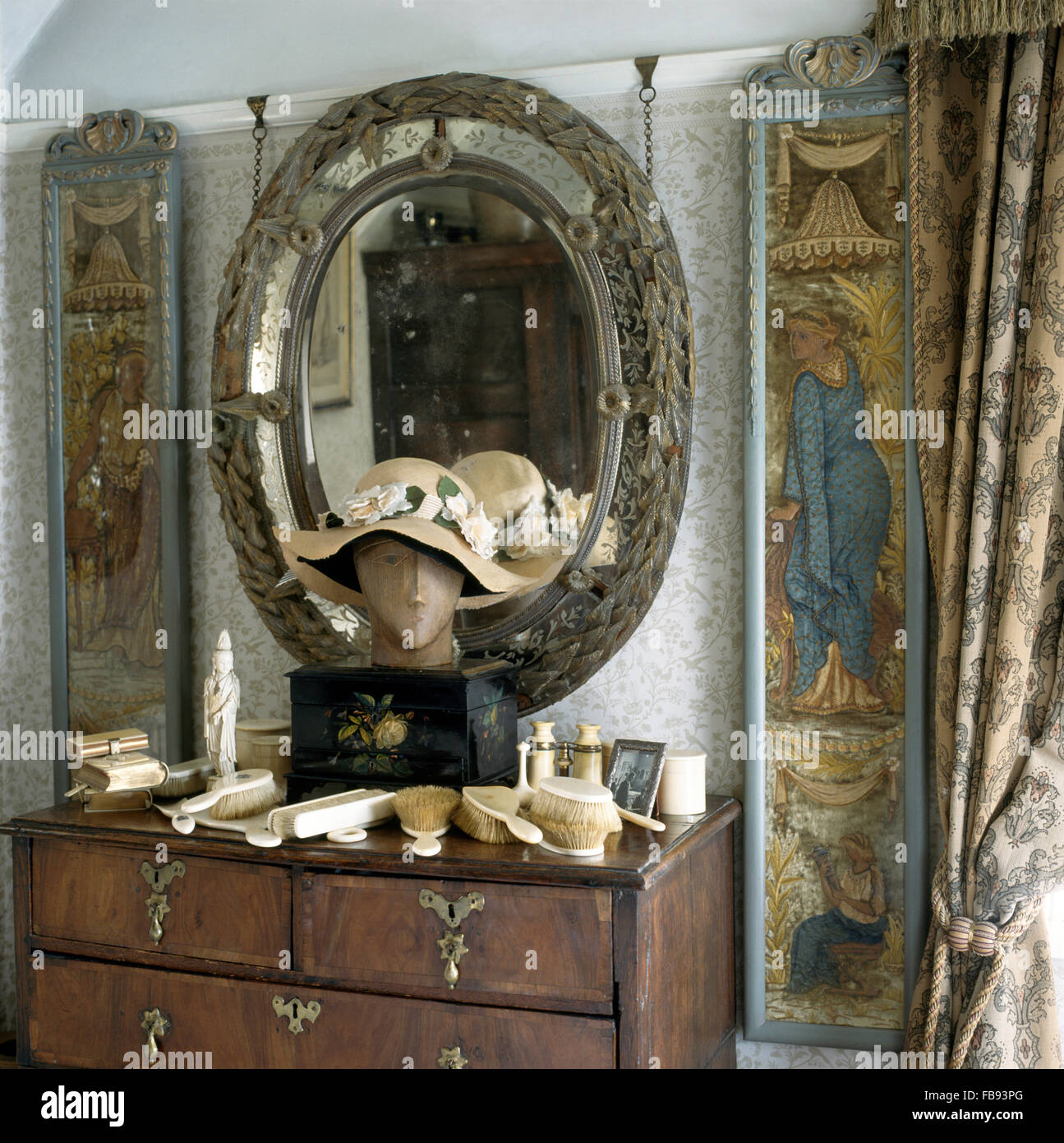 Oval Antique Mirror And Medieval Panels Above Chest Of Drawers