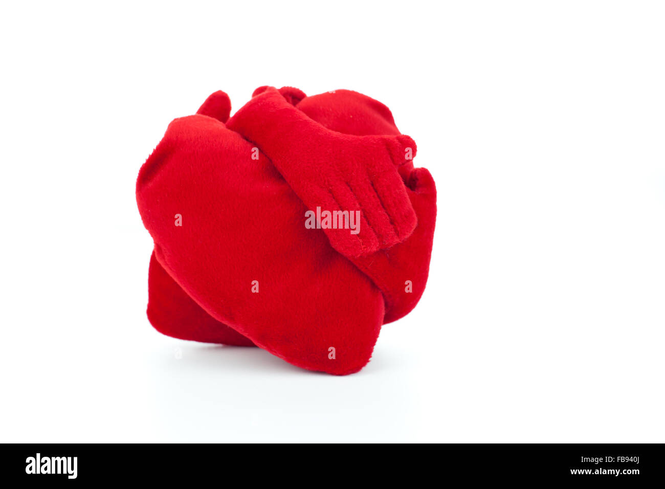 Embracing Plush hearts on white background Stock Photo