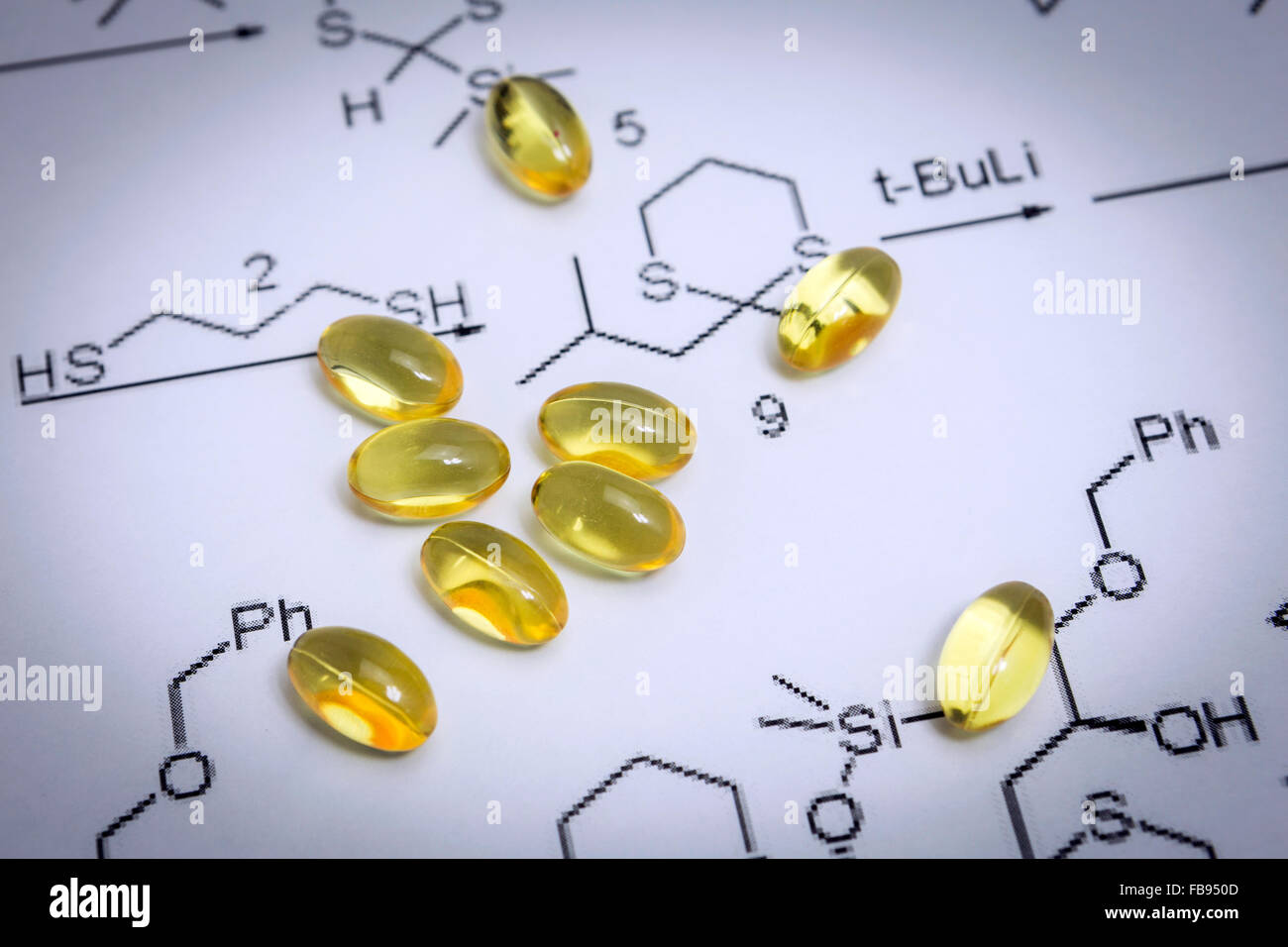Chemistry science formula and oil capsules. Medicine concept Stock